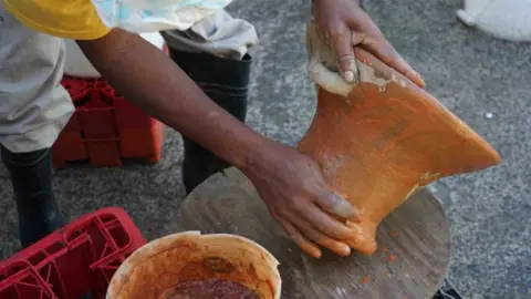 BBC A traditional coal pot being made by hand