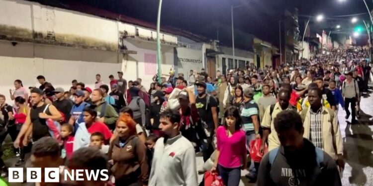 Crowds of people walking streets at night