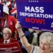 An elderly Trump supporter in a white and red outfit holds a card that reads