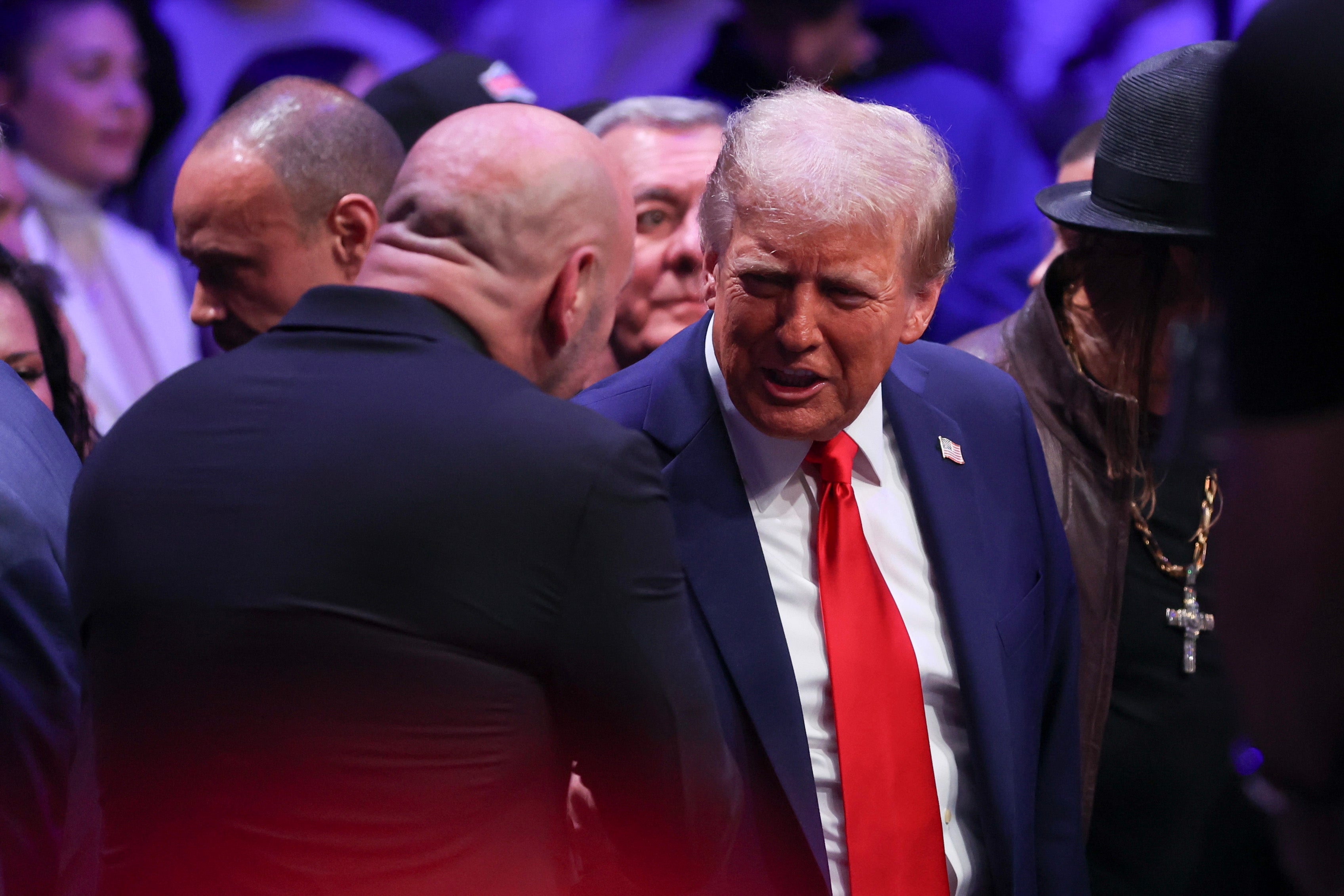 Donald Trump shakes hands with Joe Rogan at Madison Square Garden on Saturday night