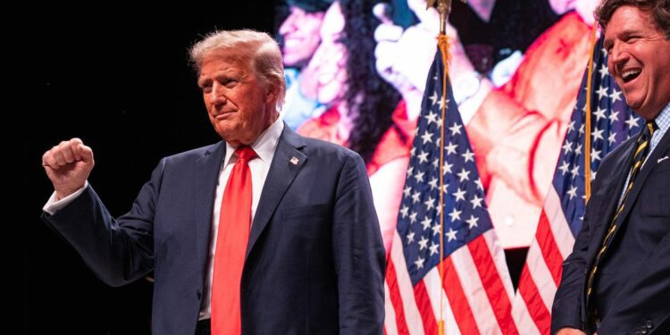 Trump's friendly chat with Carlson revs up supporters at AZ rally