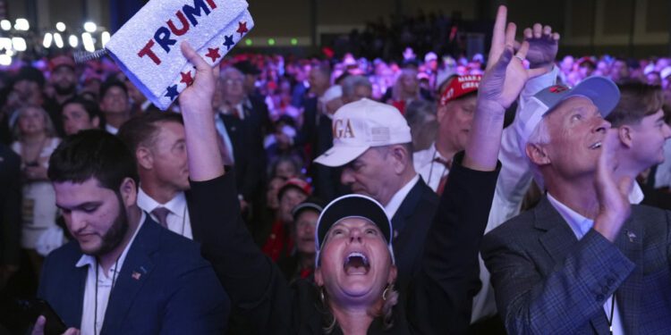 Supporters watch returns at a campaign election night watch party for Republican presidential nomin...
