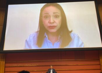 María Corina Machado appears virtually from Venezuela for a conversation with Larry Diamond at an FSI event.