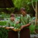 two thai workers look at fresh vegetables locally sourced for a hotel restaurant in Phuket Thailand source rosewood