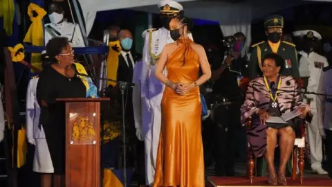 PA Media Rihanna (centre) attends the Presidential Ceremony in Heroes Square, Bridgetown