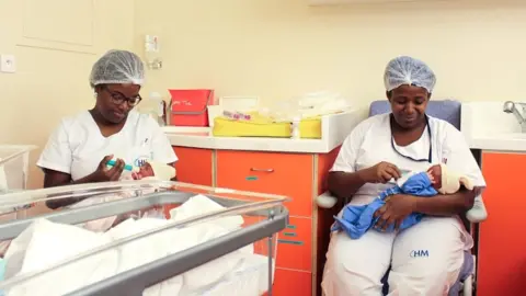 AFP Nurses feed and care for newborn babies in the nursery and intensive care unit of the Mayotte Maternity Hospital in Mamoudzou on 14 March 2018