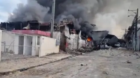 Reuters In this screen-grab, obtained from social media, smoke billows out of a building, following the explosion in San Cristobal, Dominican Republic - 14 August 2023