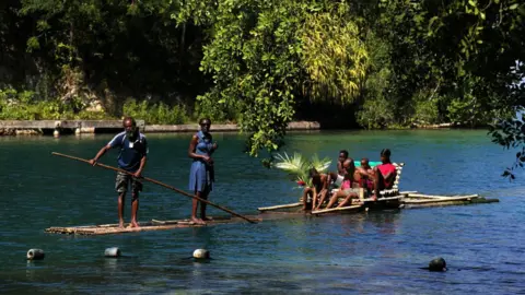 Valery Sharifulin via Getty Local residents swimming in the Blue Lagoon