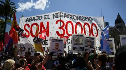 Getty Images Members of leftist movements demonstrate during the first protest, called by the Polo Obrero labour union, against elected President Javier Milei and his plans to reform the economy, in Buenos Aires on November 23, 2023, after joining Madres de Plaza de Mayo association members in their weekly protest for the people who disappeared during the 1976-1983 Argentine dictatorship.