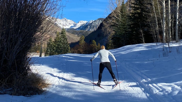 skate skiing the trails at the Vail Nordic Center—one of the most fun mountain towns in Colorado