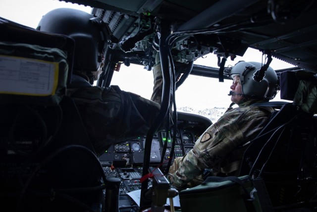 Alaska Army National Guard Chief Warrant Officer 3 Colton Bell, left, and Lt. Col. Todd Miller, UH-60L Black Hawk pilots with the 207th Aviation Troop Command, prepare for takeoff for an Innovative Readiness Training mission at Bethel, Alaska,...