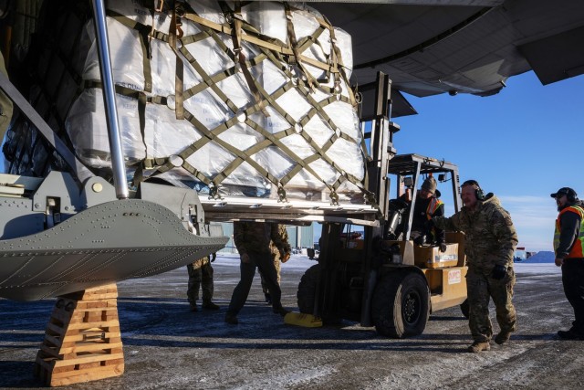 Alaska Air National Guardsmen and local airport personnel offload a pallet of frozen meat from a 211th Rescue Squadron HC-130J Combat King II during an Innovative Readiness Training mission at Bethel, Alaska, Nov. 15, 2024. Two years ago, the...