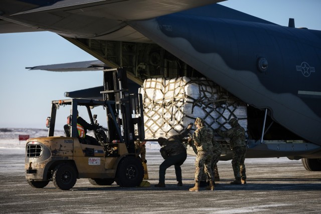 Alaska Air National Guardsmen and local airport personnel offload a pallet of frozen meat from a 211th Rescue Squadron HC-130J Combat King II during an Innovative Readiness Training mission at Bethel, Alaska, Nov. 15, 2024. Two years ago, the...