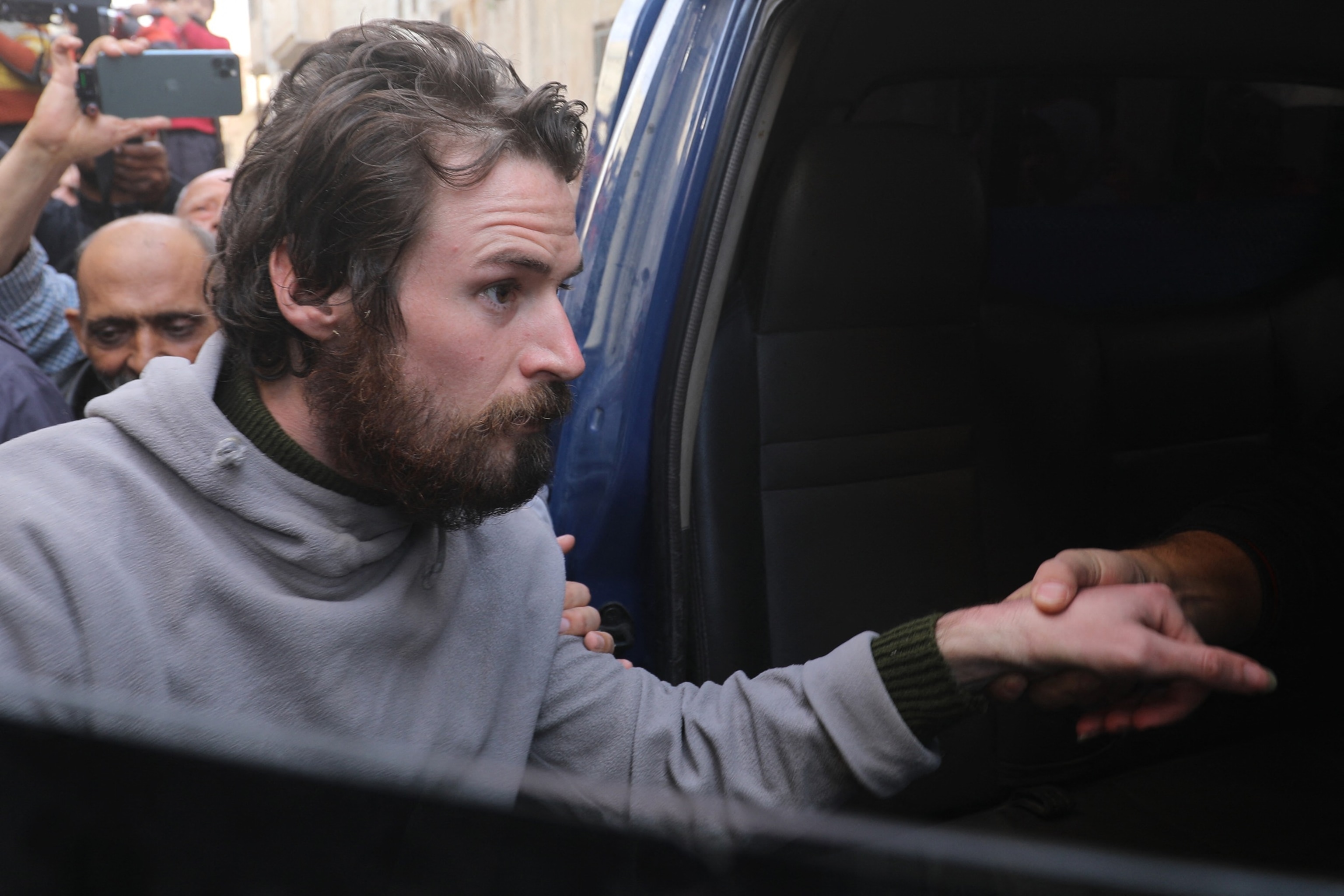 PHOTO: Travis Timmerman, a U.S. citizen who had entered Syria from Lebanon on a Christian pilgrimage and had been detained for several months, enters a car in Damascus, Dec. 12, 2024.