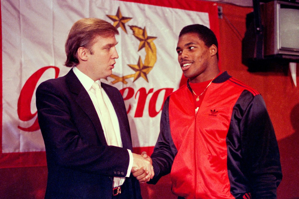 In this March 8, 1984, file photo, Donald Trump shakes hands with Herschel Walker in New York after agreement on a 4-year contract with the New Jersey Generals USFL football team. 