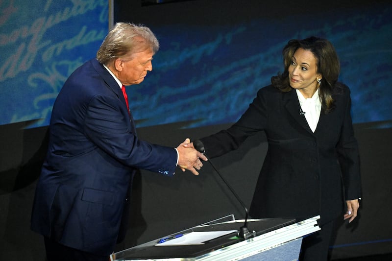 Kamala Harris shakes hands with Donald Trump before their televised debate in Philadelphia in September. Photograph: Saul Loeb/AFP via Getty Images