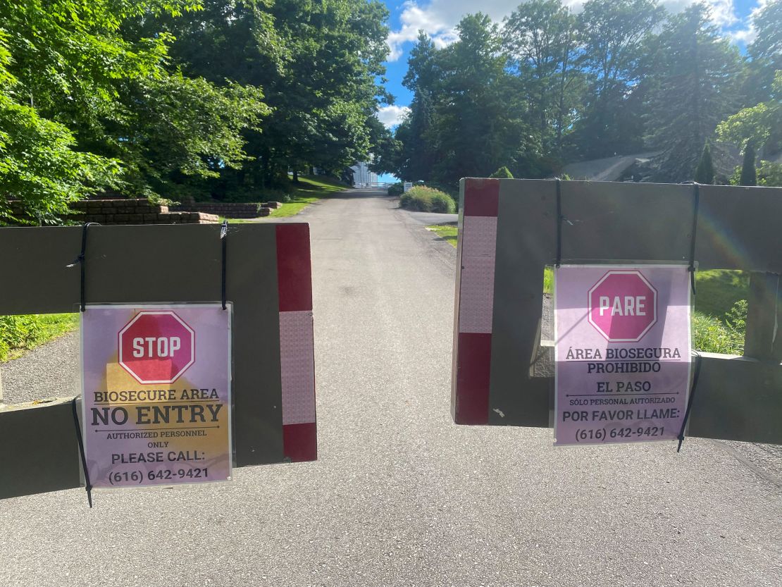 Warning signs are placed at an entry to an egg producer's farm in Ionia County, Michigan, in June.