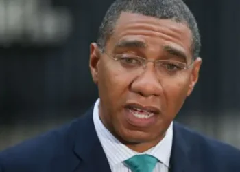 DANIEL LEAL-OLIVAS/GETTY Jamaica's Prime Minister Andrew Holness speaks to the media outside 10 Downing Street in central London, on 17 April 2018