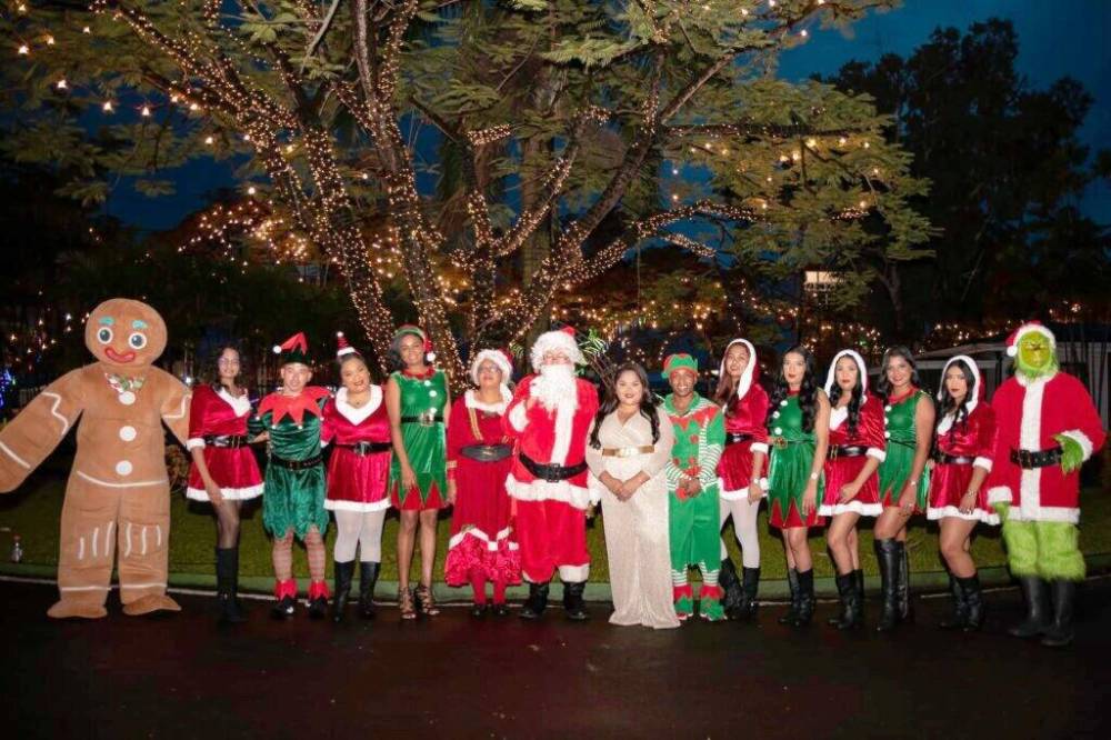 Supplied photo
                                Guyana’s First Lady, Arya Ali (in white at the centre of picture) hosts a Christmas reception at State House, the official residence of the president in Georgetown, Guyana. Correspondent Derek Dabee writes that Guyanese Christmas celebrations are often held outdoors.