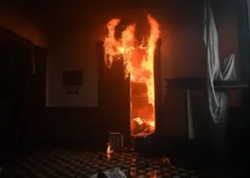 Getty Images View of an office of the Congress building set on fire by demonstrators demanding the resignation of President Alejandro Giammattei, in Guatemala City on 21 November 2020.