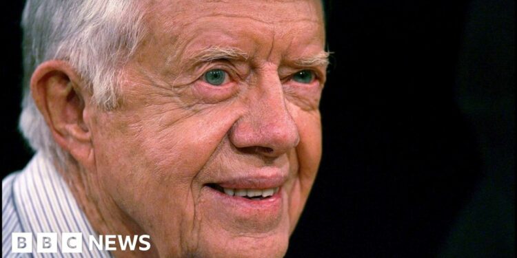 Jimmy Carter smiles into the distance in his old age.