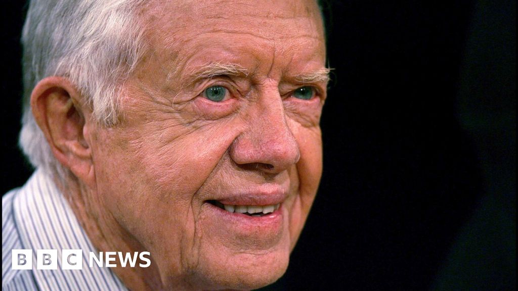 Jimmy Carter smiles into the distance in his old age.