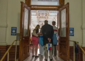 Getty Images A trans youth and her family attends a rally in support of trans rights at the Texas State Capitol