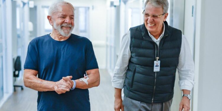 This handout picture released by the Brazilian Vice-Presidency shows President Luiz Inácio Lula da Silva (left) walking with his neurosurgeon Dr Marcos Stavale in the Syrian-Lebanese Hospital in São Paulo, Brazil, on December 13, 2024.