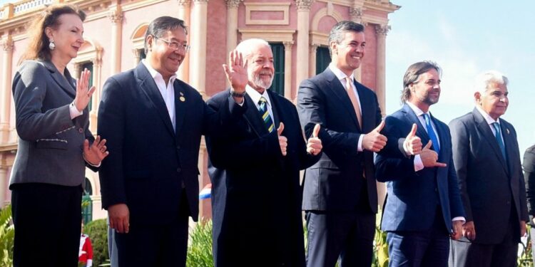 Left to right: Argentina's Foreign Minister Diana Mondino, Bolivia's President Luis Arce, Brazil's President Luiz Inácio Lula da Silva, Paraguay's President Santiago Peña, Uruguay's President Luis Lacalle Pou, and Panama's President José Raúl Mulino pose for the family photo at the Palacio de López Presidential Palace during the Mercosur summit in Asuncion on July 8, 2024.