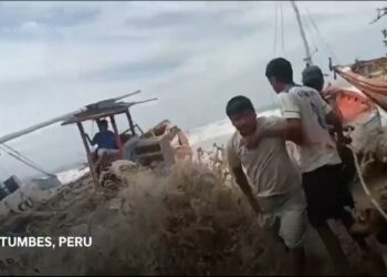 Peru's Navy rescues dozens of fishermen stranded at sea as giant waves pound shore