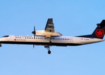 Air Canada flight skids down runway during hard landing, catches fire