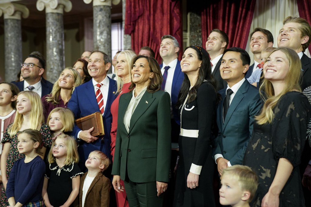 Vice President Kamala Harris participating in the ceremonial swearing-in ceremony with Senator John Curtis and his family in the Old Senate Chamber at the U.S. Capitol