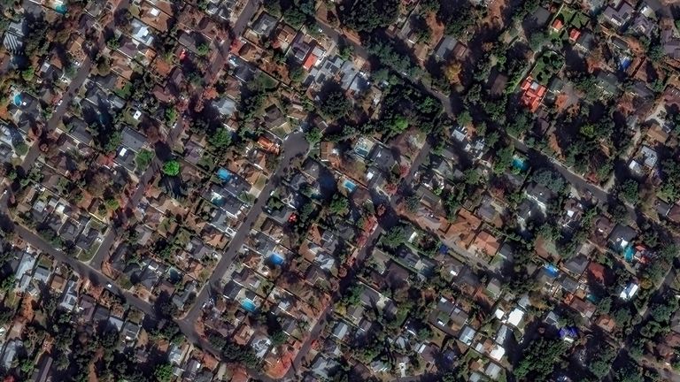 A satellite image shows houses before devastating wildfires, in Altadena, California.
Pic: Maxar/Reuters