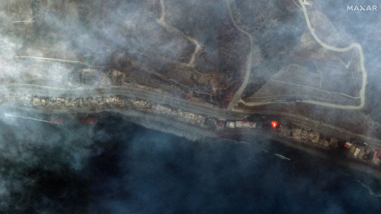 A satellite image shows smoke covering the Pacific Coast Highway along the Malibu coastline.
Pic: Maxar/Reuters