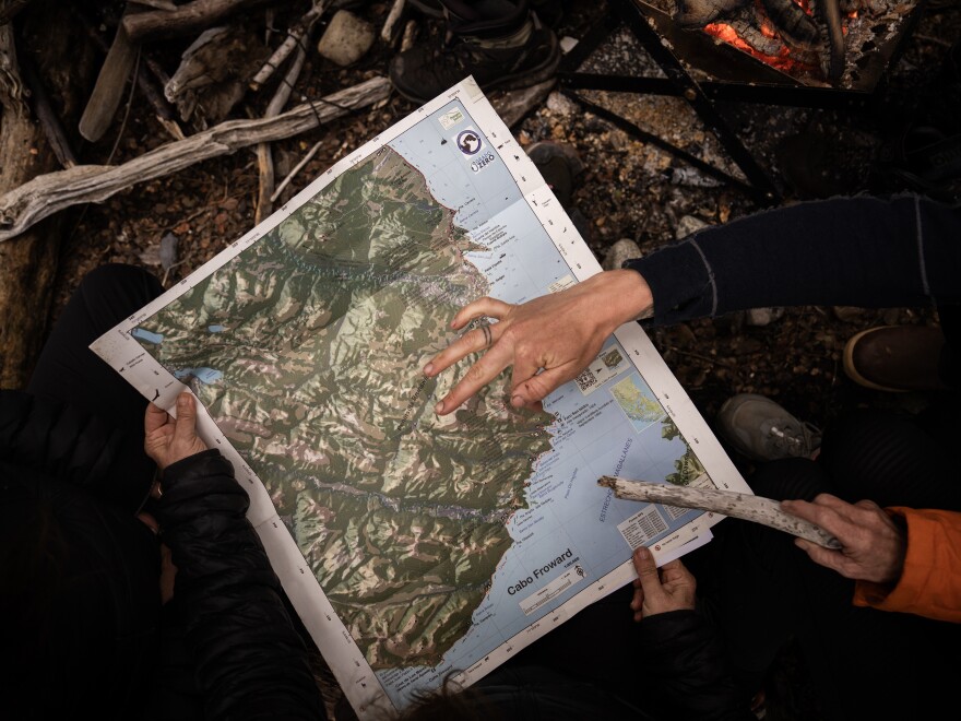 Kristine Tompkins, founder of Tompkins Conservation, and her team analyze the map of the future Cape Froward National Park in order to make decisions on where certain facilities should be located and which areas should remain protected in Patagonia, Chile, on Nov. 3, 2024.