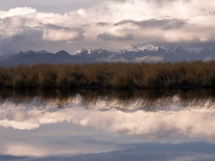 Pastures adorn the landscape along the Río Nodales, creating a reflection at sunset.