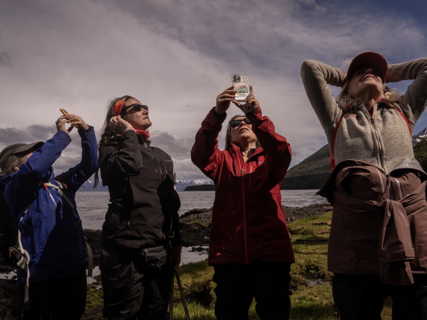 Members of the Cape Froward expedition group take pictures of the landscape in Patagonia, Chile, on Nov. 3, 2024.