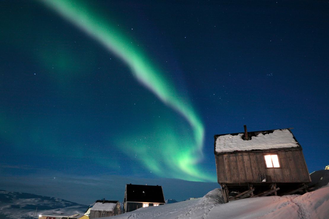 The northern lights, pictured here in Tiniteqilaq in the district of Ammassalik in East Greenland, are winter's big tourist draw.