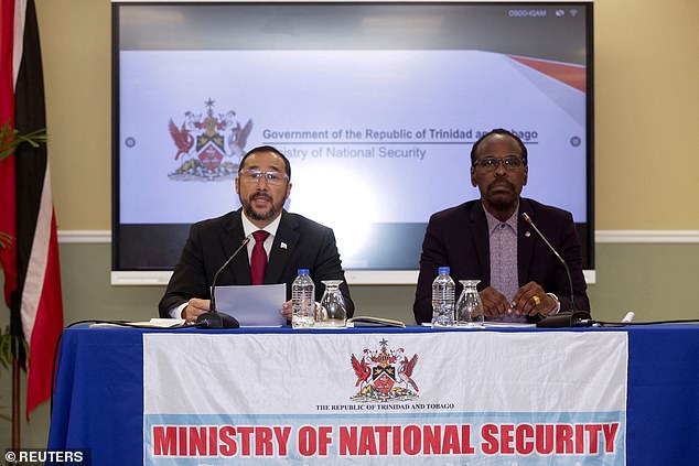 In the prime minister's absence, acting attorney general Stuart Young, left, was tasked with announcing a state of emergency together with national security minister Fitzgerald Hinds