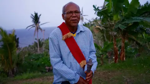 Gemma Handy Current Chief Charles Williams with ceremonial sash and mace.