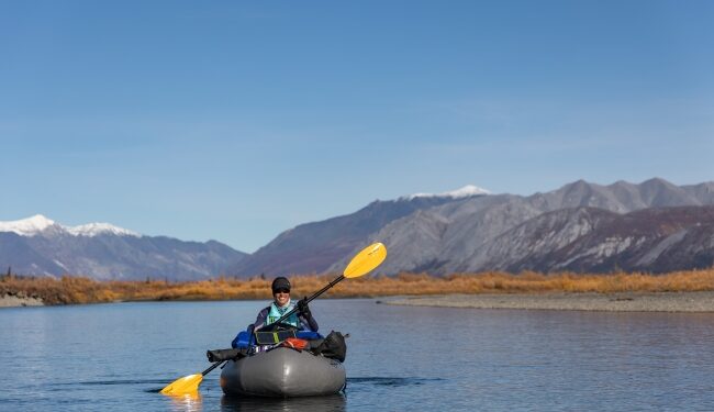 A paddler at a river in the Arctic National Wildlife Refuge, Alaska.