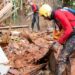 Firefighters work on a landslide site at Bethania neighbourhood, Ipatinga, Minas Gerais state, Brazil on January 12, 2025.