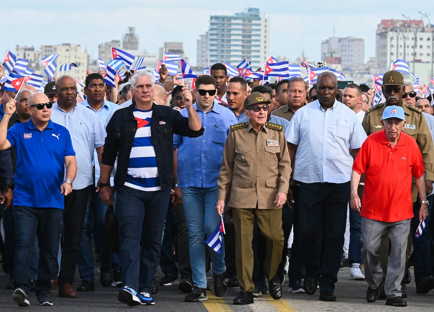 Cuban President Miguel Diaz-Canel, center left, and former President Raul Castro, center right, marched against the US embargo of the island nation in Havana in December.