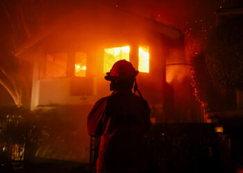 California wildfires rage in LA County, killing at least 10 and destroying thousands of homes