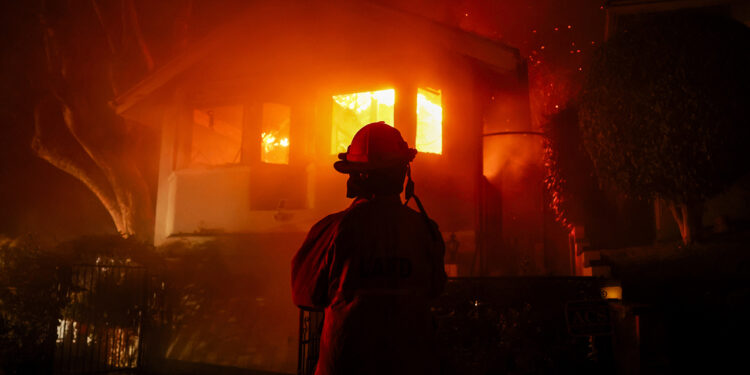 California wildfires rage in LA County, killing at least 10 and destroying thousands of homes