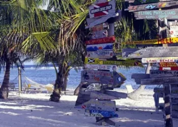 Getty Images Signs on a beach on the Cayman Islands