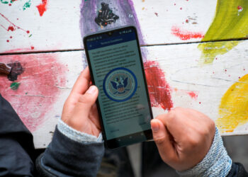 Sofia Mendez, a migrant from Honduras, uses a CBP One application in Piedras Negras