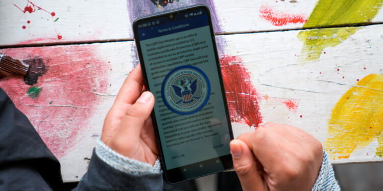 Sofia Mendez, a migrant from Honduras, uses a CBP One application in Piedras Negras