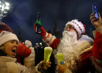 People react as they take part in New Year celebrations in central Moscow, Russia, January 1, 2025.