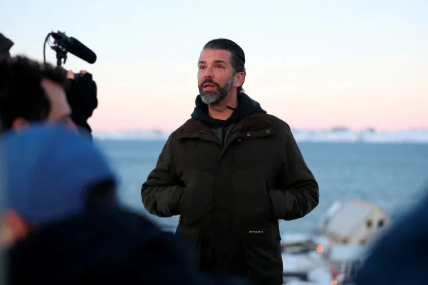 Donald Trump Jr. being interviewed outdoors.